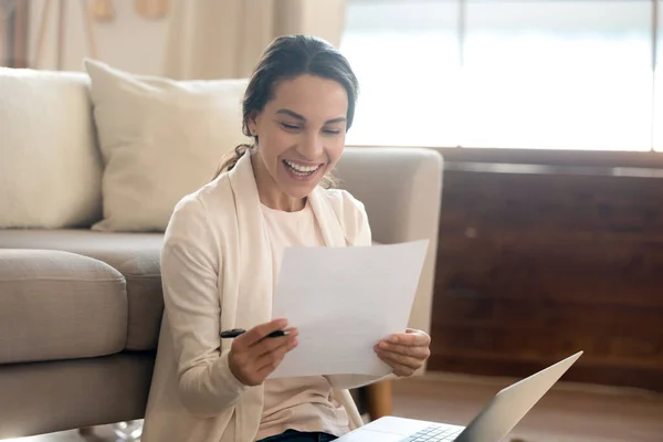 Happy young woman excited with good postal letter
