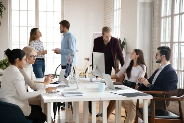 Diverse concentrated successful young businesspeople workday in modern office. — Stock Photo, Image