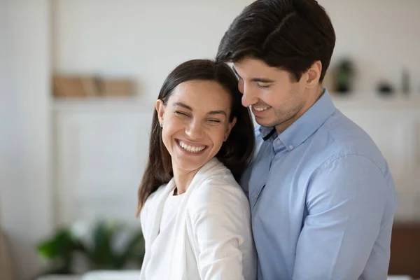 Overjoyed young couple hug showing care and affection — Stock Photo, Image
