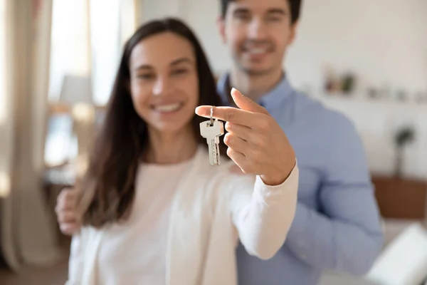Close up of excited couple show new home keys — Stock Photo, Image