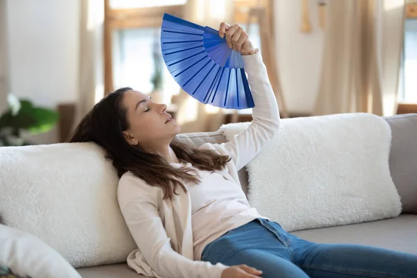 Unwell young woman sue waver suffering from heatstroke — Stock Image Unwell young woman sue waver suffering from heatstroke Royalty Free Stock Photos