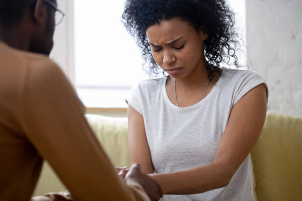 Upset African wife receive moral support from husband concept