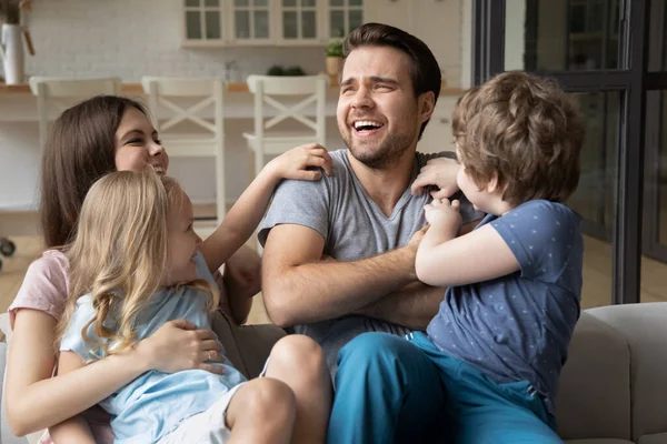 Happy young family have fun playing together — Stock Photo, Image