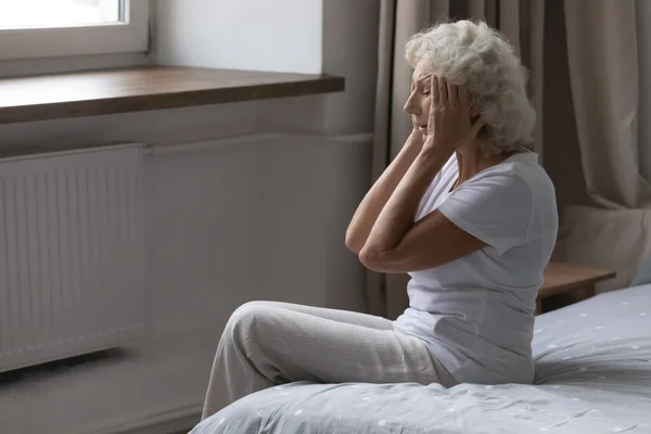 Senior woman feel unhealthy suffering from migraine