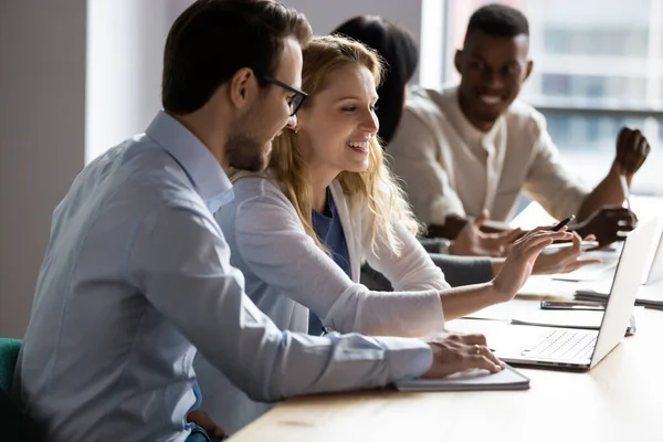 Colleagues working on common project prepare presentation using laptop — Stock Photo, Image