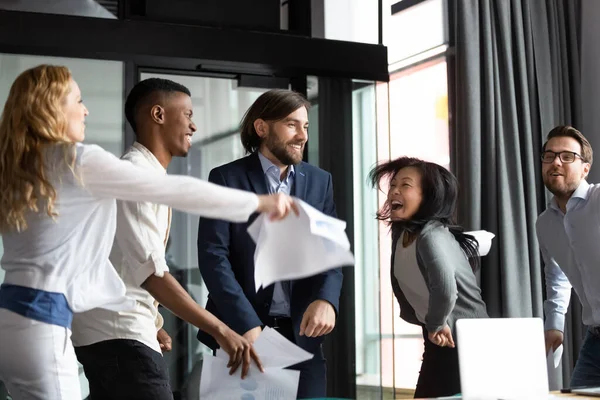 Multiracial staff screaming with joy dancing having fun at workplace — Stock Photo, Image