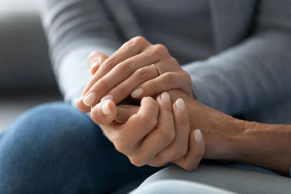 Closeup caring adult daughter holding mothers hand provides psychological support — Stock Photo, Image