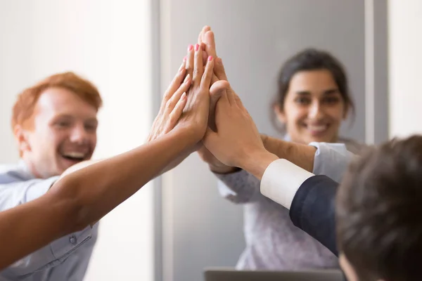 Happy diverse employees giving high five, celebrating success — Stockfoto