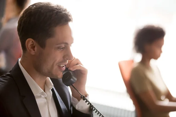Confident businessman employee talking on phone close up — Stockfoto