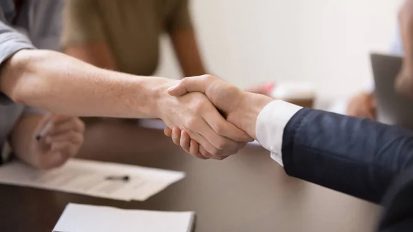 Close up business partners handshaking after successful negotiations — Stockfoto