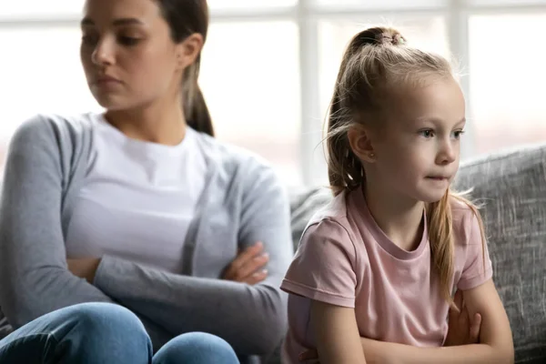 Close up upset little girl ignoring mother after quarrel — Stock fotografie