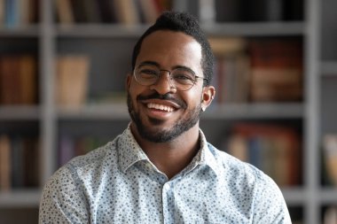 Headshot portrait african guy smiling looking at camera