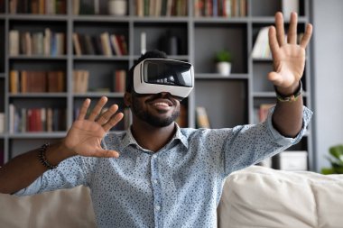African guy wear headset enjoy virtual reality online game simulation