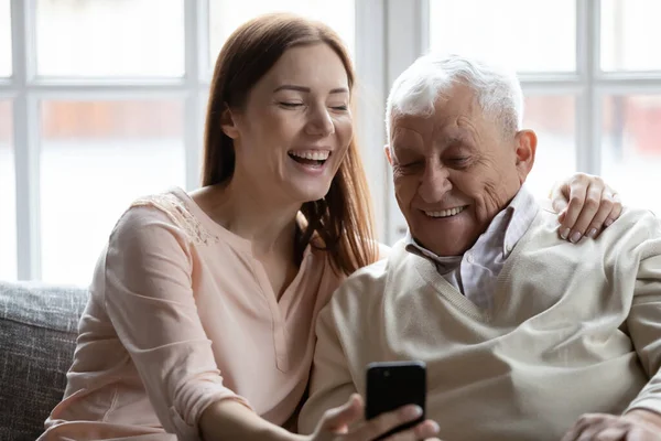 Close up smiling older man with grownup daughter making selfie — Stock Photo, Image