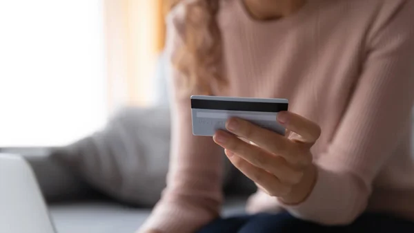 Close up woman paying online, holding plastic credit card — Stockfoto