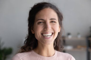 Head shot portrait laughing overjoyed beautiful woman looking at camera
