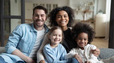 Beautiful multi-ethnic kids and their parents family portrait