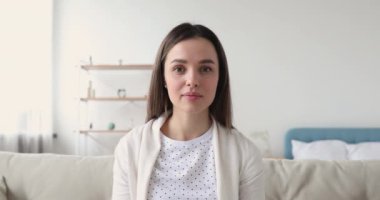 Smiling female blogger recording video for social networks.