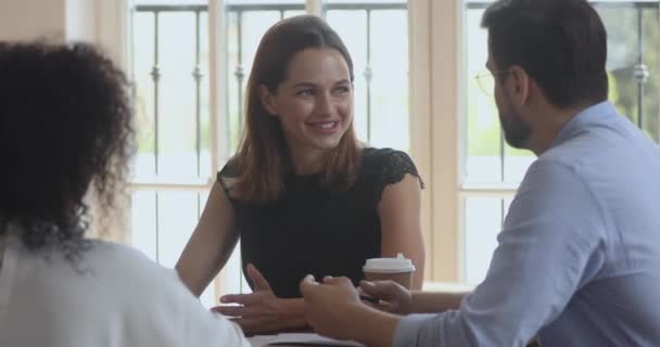 Female and male colleagues partners talk collaborate at group meeting — Stock Video