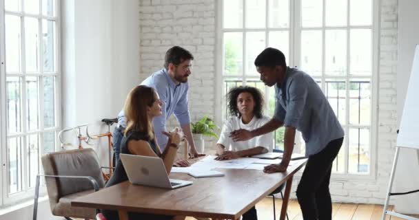 Diverse male colleagues give high five at company team meeting — Stock Video