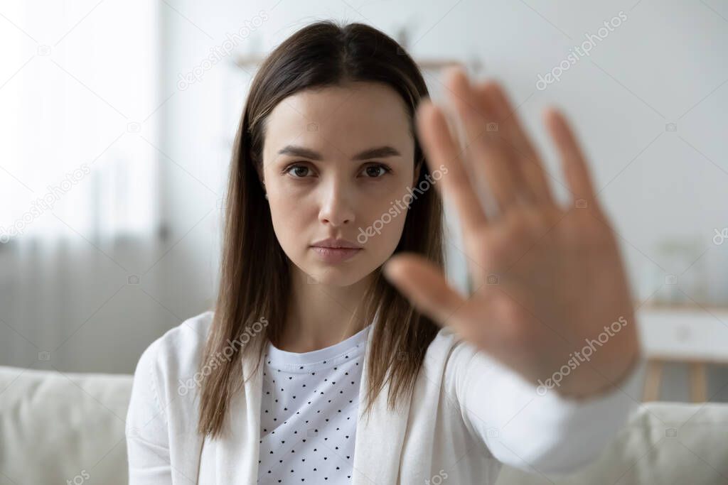 Woman showing stop gesture struggling for women right