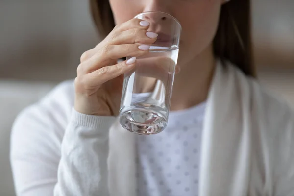 Woman drinking still or mineral water close up concept image — Stock Photo, Image