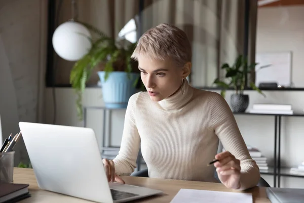 Focused businesswoman working on research sit at desk use laptop — Stock Photo, Image