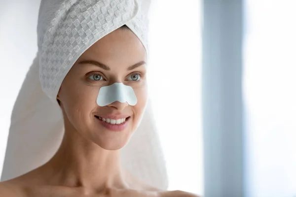 Millennial female using cleansing pores nose strips — Stock Photo, Image