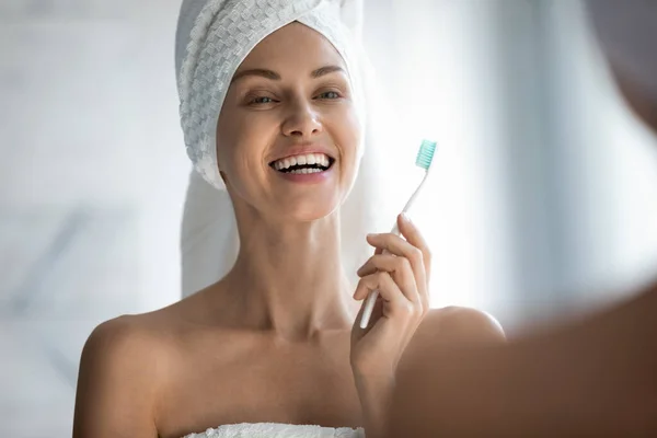 Smiling female perform daily morning oral hygiene at home — Stock Photo, Image