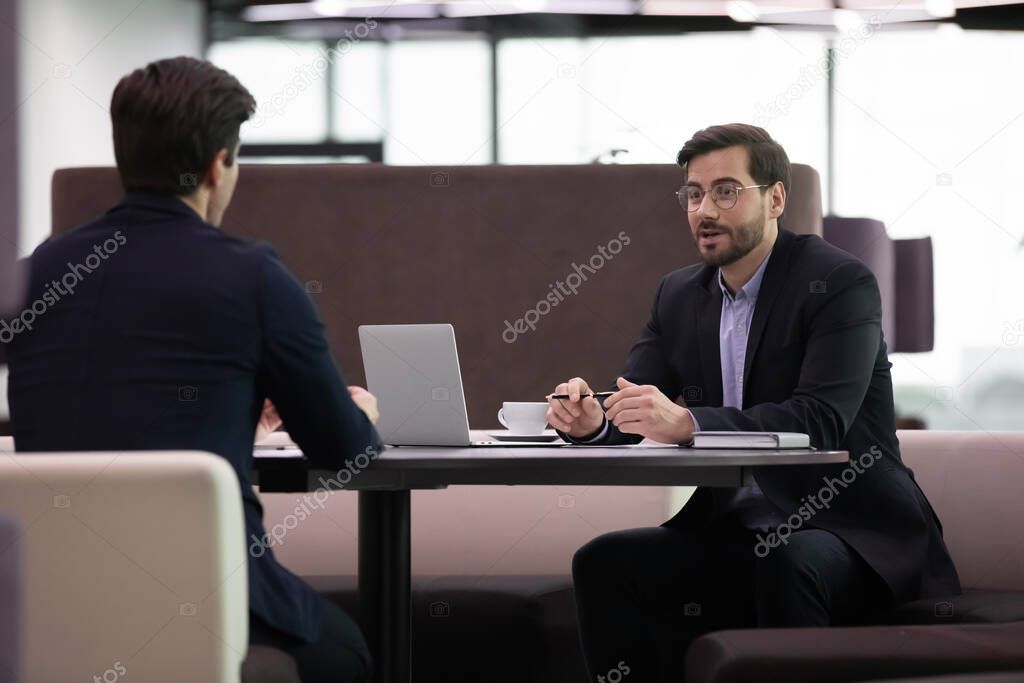 Job interview, hr manager interviewing male candidate asking questions