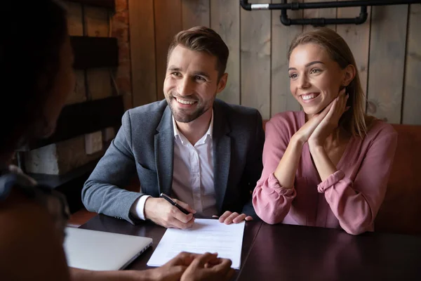 Clients new homeowners enjoy moment of contract sign finish negotiations