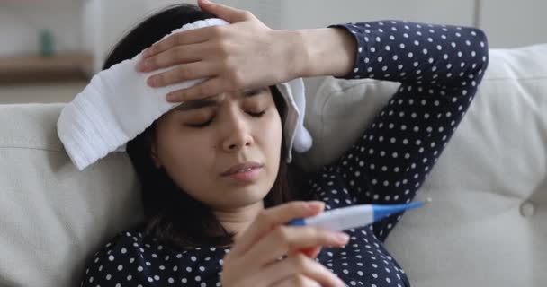 Closeup Asian woman holding thermometer check body temperature feels sick — Stock Video