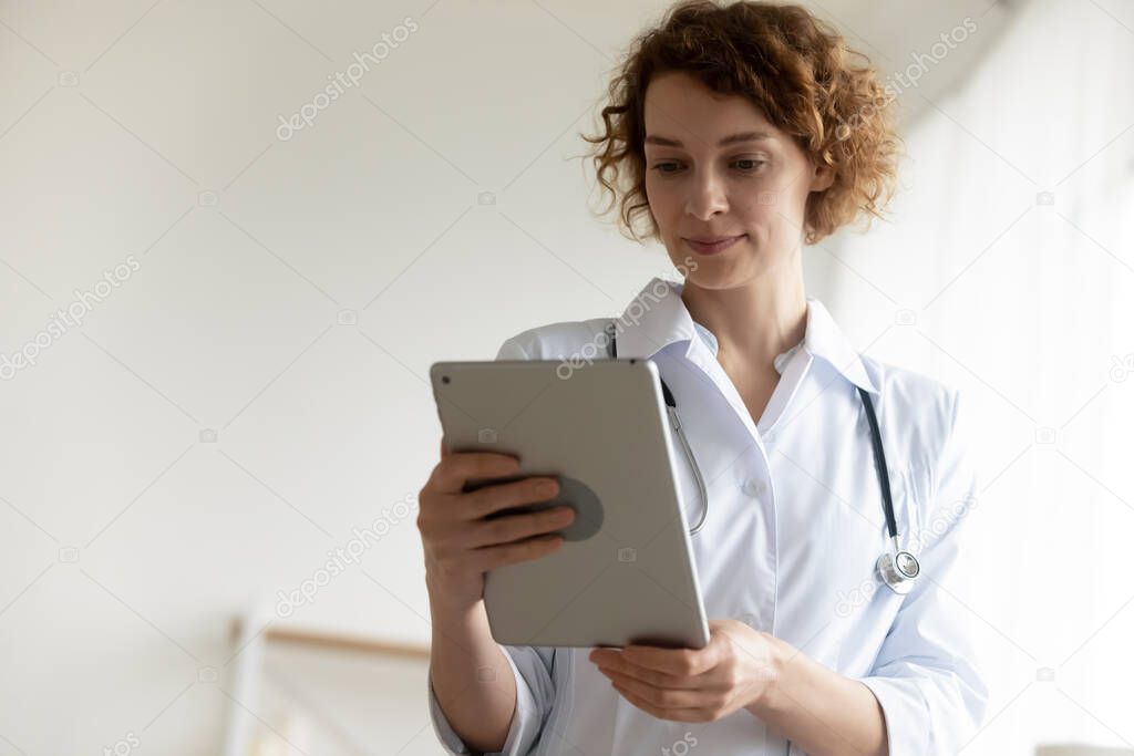 Female doctor have video call on tablet
