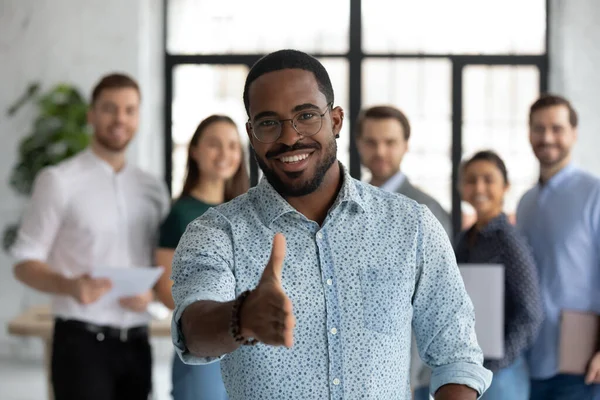 African sales manager stretch out hand introduces himself to client — Stock Photo, Image