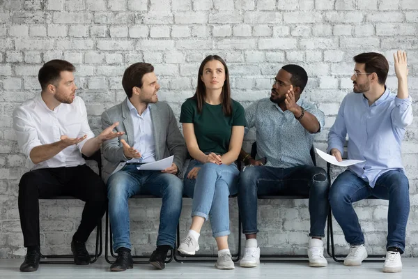 Men applicants wait for job interview show disrespect for girl — Stock Photo, Image
