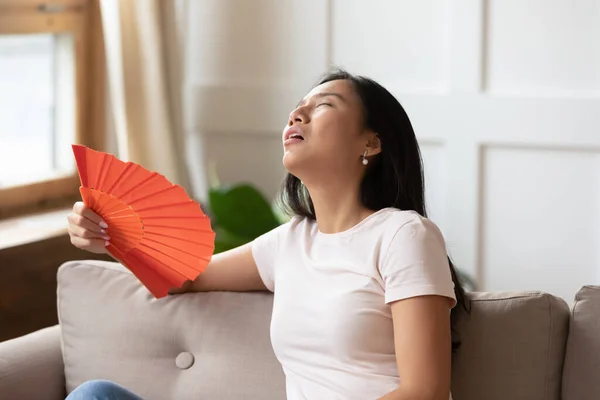 Exhausted young vietnamese biracial woman suffering from heat stroke. — Stock Photo, Image