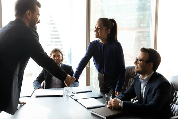 Happy young female hr team leader shaking hands with candidate. — Stock Photo, Image