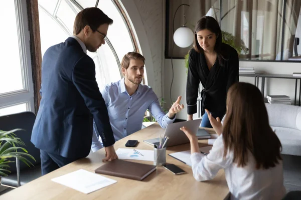 Multiracial employees engaged in team discussion at meeting — Stock Photo, Image