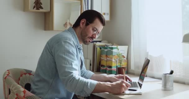 Man working on laptop feels tired take off glasses — Stock Video