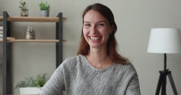 Woman looking at camera greeting friend start conversation by videocall — Stock Video