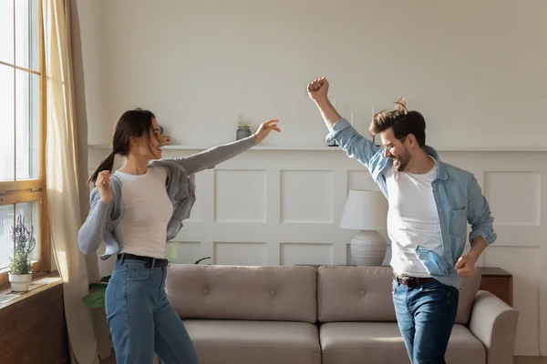 Happy excited family spouses dancing to favorite music. — Stock Photo, Image