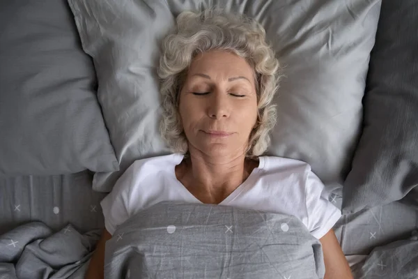 Top view elderly woman sleeping in the bed — Stock Photo, Image