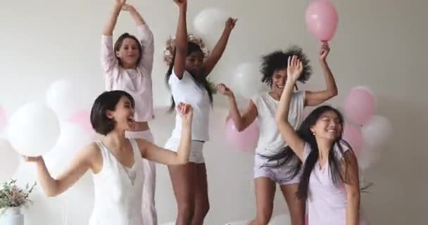 Overjoyed young mixed race girls celebrating birthday bridal bachelorette shower. — Stock Video