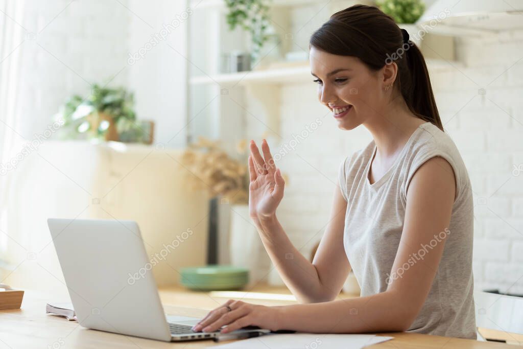 Pleasant millennial female teacher starting distant lesson online