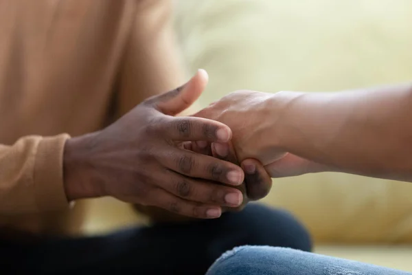 African husband holding biracial wife hands with care and love — Stock Photo, Image
