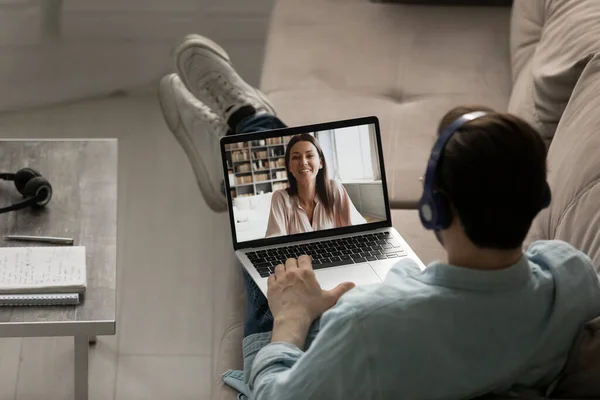 Back view of man talk on webcam conference with woman — Stock Photo, Image