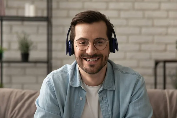 Headshot portrait of man in headphones talk on video call — Stock Photo, Image