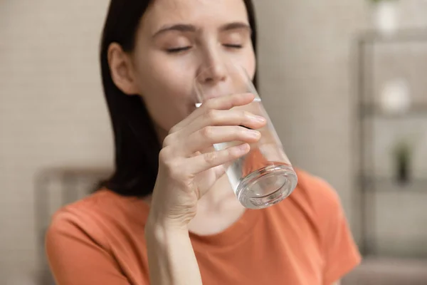 Thirsty girl drink clean mineral water from glass — Stock Photo, Image