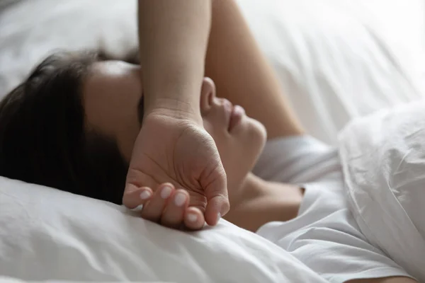 Close up sleepless woman lying in bed, suffering from insomnia — Stock Photo, Image