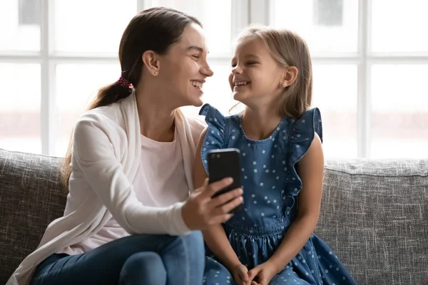 Happy young woman recording video with little cute daughter. — Stock Photo, Image